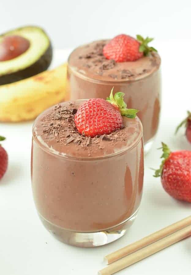 Banana, strawberry and chocolate milkshake in plastic cup with