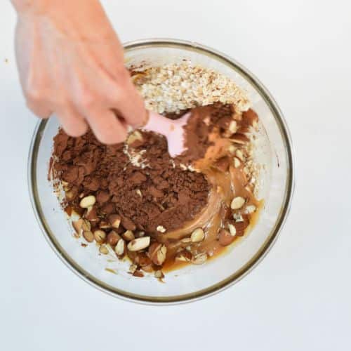 Combining Healthy No-Bake Oatmeal Cookies ingredients in a bowl.