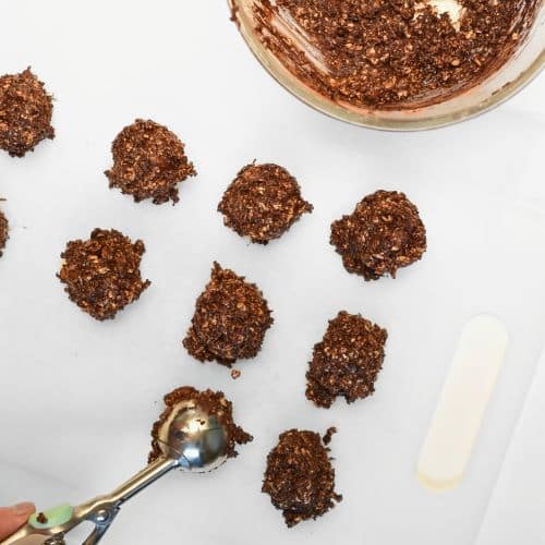 Forming Healthy No-Bake Oatmeal Cookies with a cookie spoon.