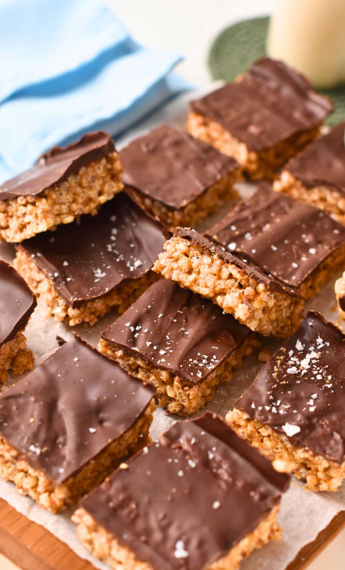 Healthy puffed bars stacked on a chopping board.