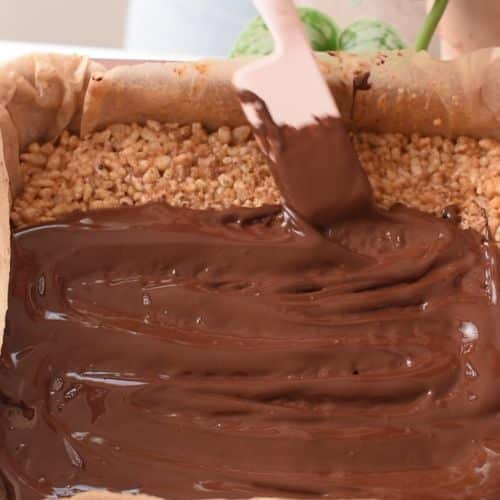 Spreading chocolate on the Healthy Puffed Rice Bars