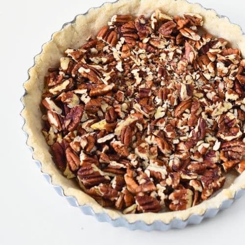 Pecan nuts on the vegan pie crust.