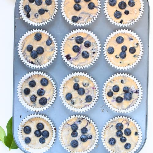 Buckwheat Blueberry Muffins in a muffin pan.