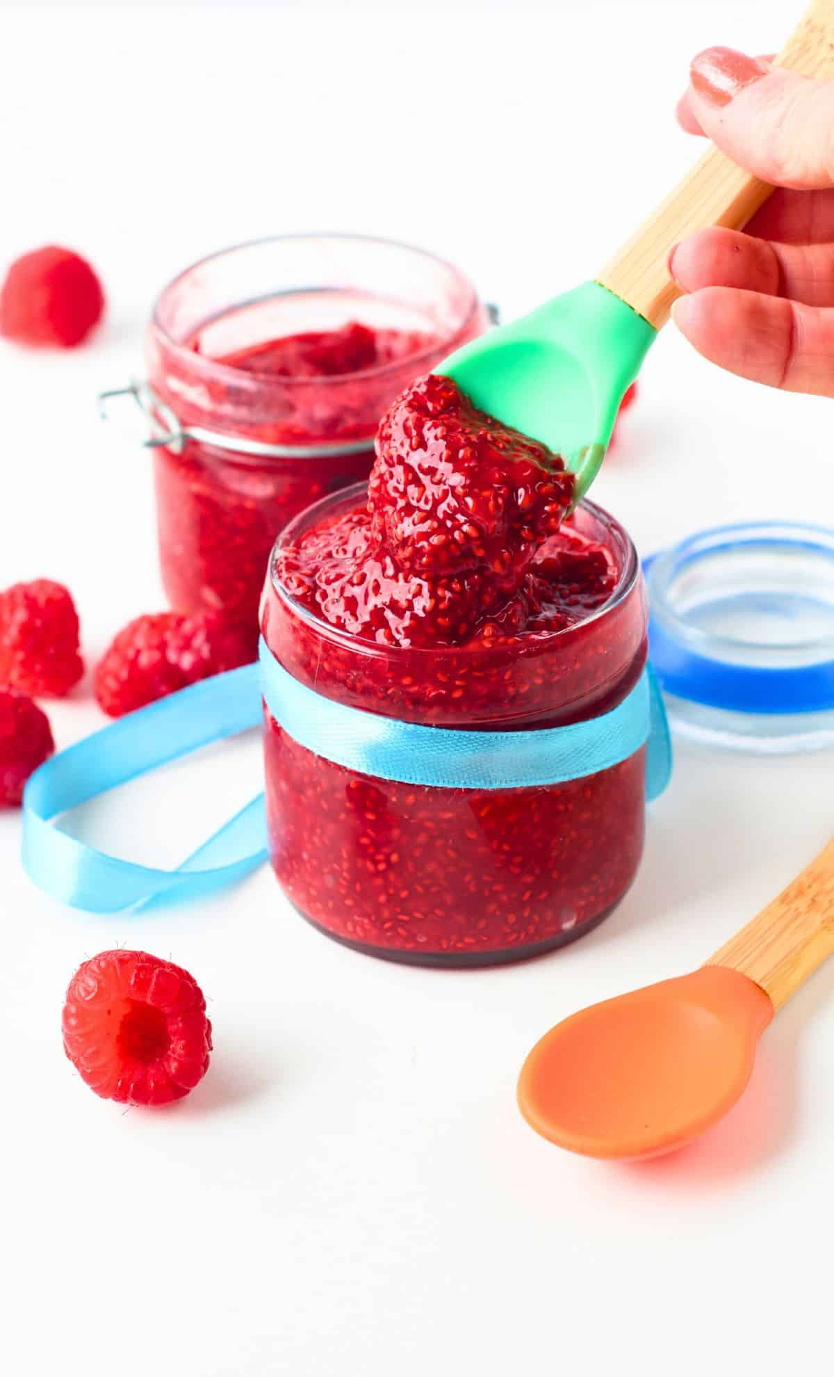 Spoon digging into a jar with Baby Jam