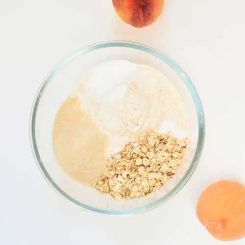 Dry Vegan Peach Muffins ingredients in a bowl.