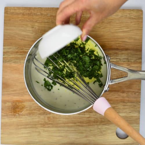 Adding herbs to the Vegan Spaghetti Squash Alfredo