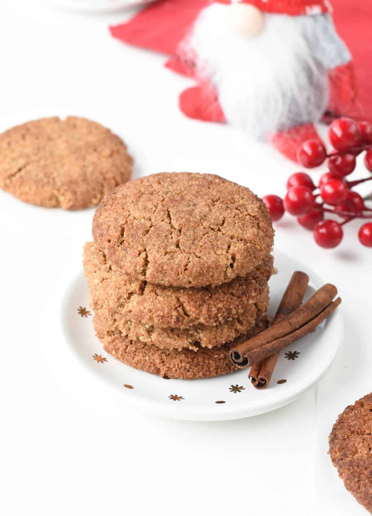 Vegan Snickerdoodles stacked on a coffee plate.