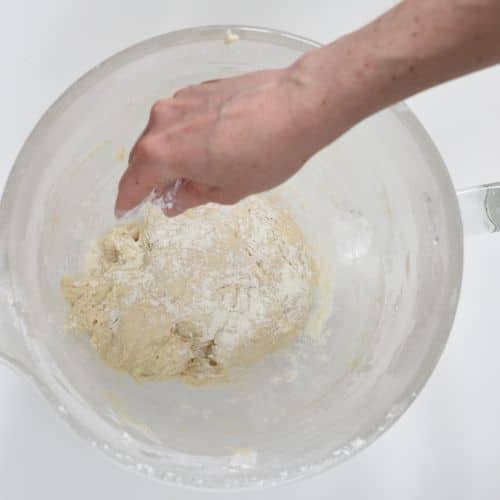 Sprinkling flour on the Vegan Naan Bread dough.