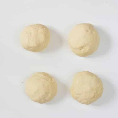 Four Vegan Naan Bread dough balls.