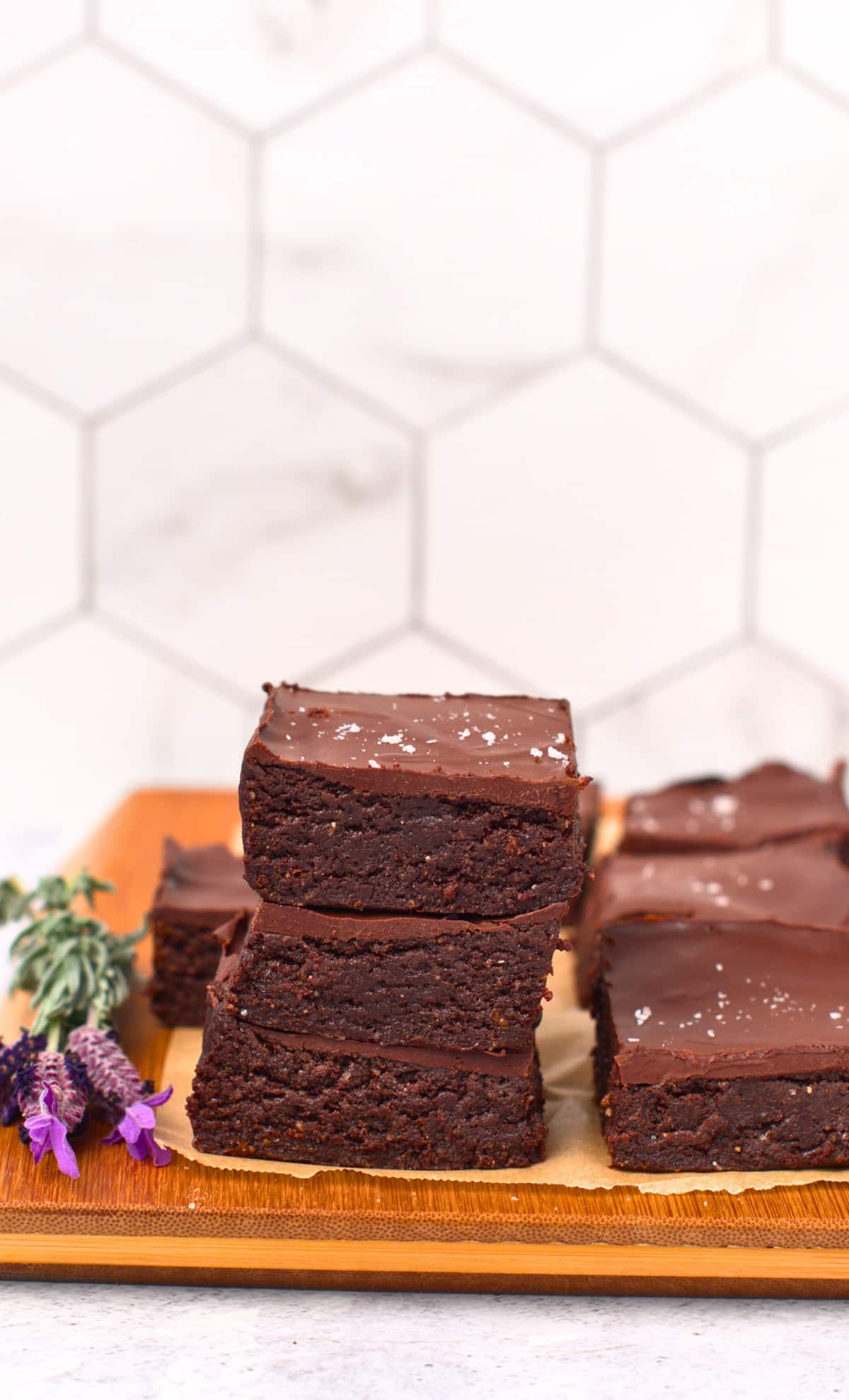 No-Bake Brownies stacked on a chopping board.