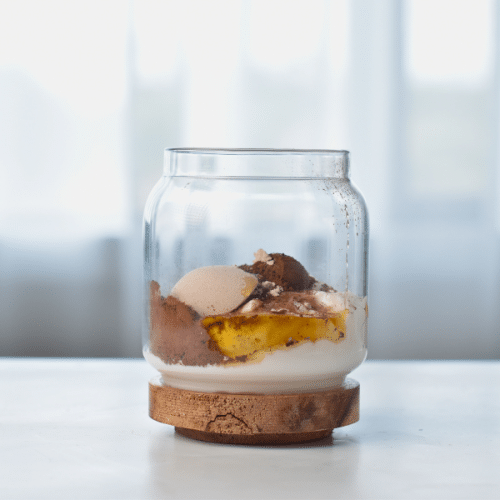 Dry Chocolate Protein Yogurt ingredients in a jar.