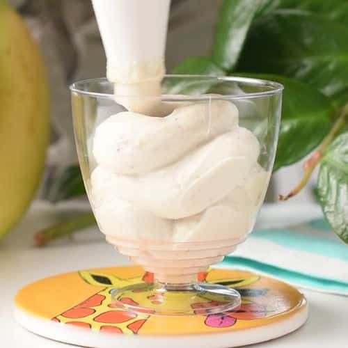 Piping the Banana Frozen Yogurt into a serving cup.