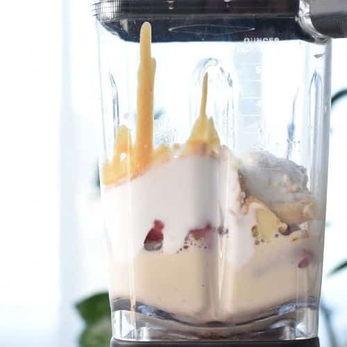 Banana Strawberry Oatmeal Smoothie ingredients blended in a blender,