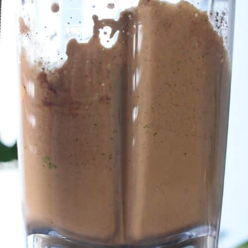 Blended Chocolate Peanut Butter Banana Smoothie in the jug of a blender.