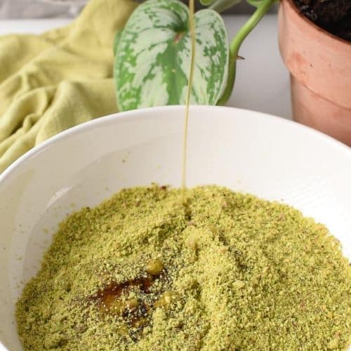 Combining pistachio cookie ingredients in a bowl.