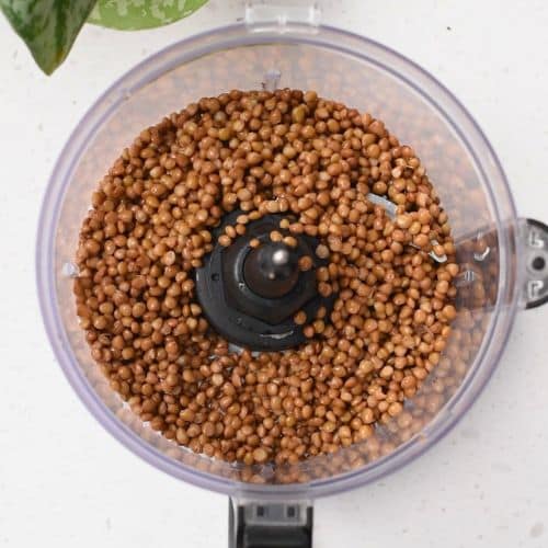 Brown lentils in a food processor.