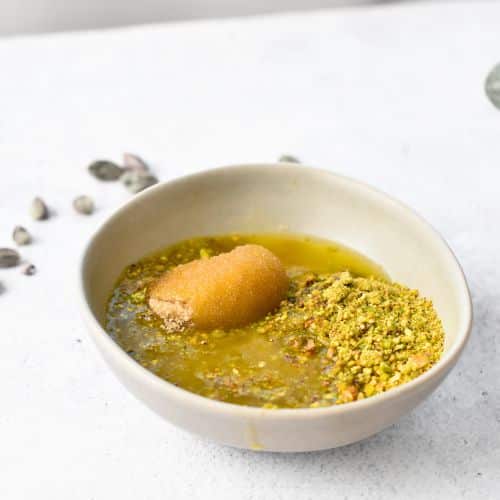 Ground pistachio in a bowl.