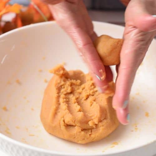 Rolling the Pumpkin Bite dough.