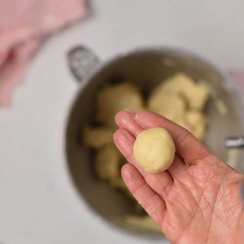 Rolled 3-Ingredient Sugar Cookie dough ball.