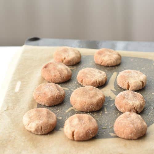 Flattened Almond Flour Snickerdoodles on a baking sheet.