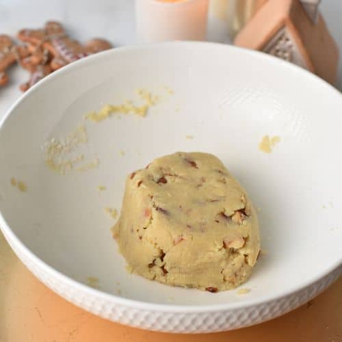 Almond Snowball Cookies dough in a mixing bowl.