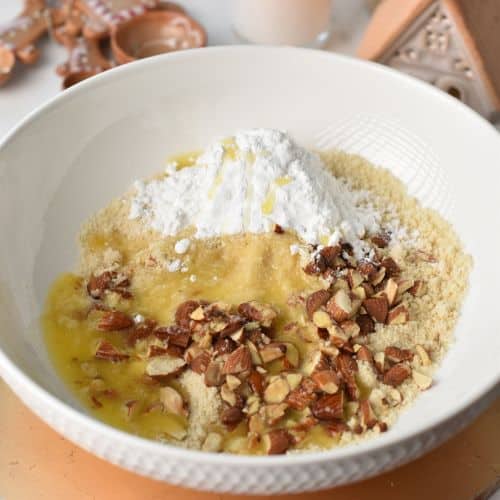 Almond Snowball Cookies ingredients in a mixing bowl.