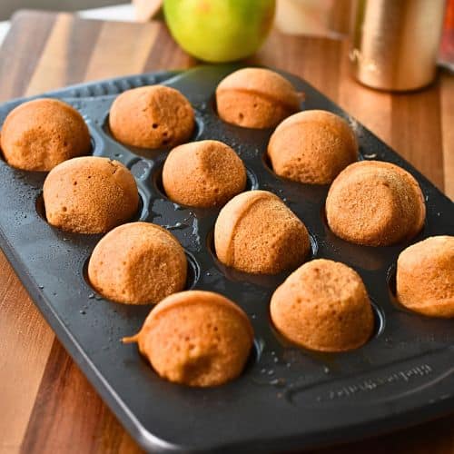 Baked Apple Cider Donut Holes in a tin..