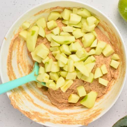 Baked Apple Fritters dough with fresh apple chunks.