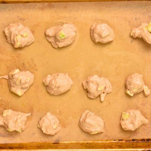 Baked Apple Fritters ready to bake on a baking sheet.