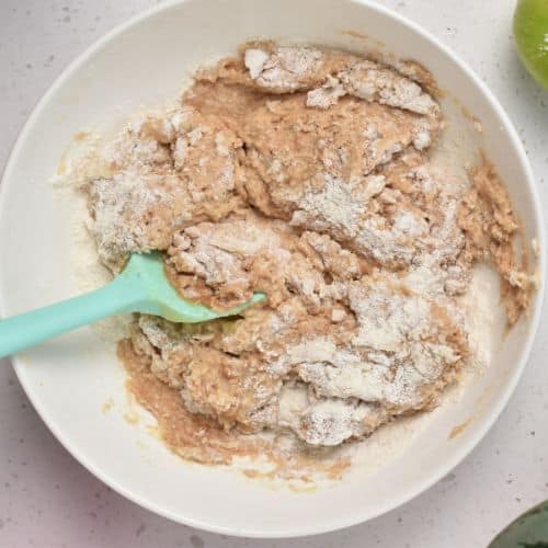 Baked Apple Fritters batter in a mixing bowl.