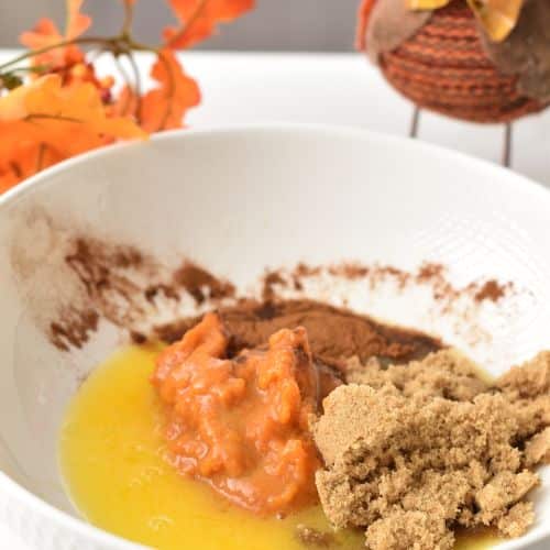 Easy Pumpkin Cookie dough liquid ingredients in a mixing bowl.