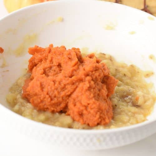 Pumpkin puree and mashed bananas in a mixing bowl.