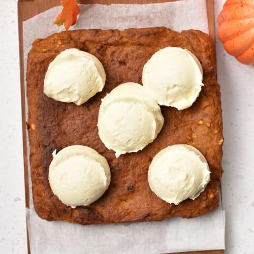 Adding frosting to the Pumpkin Banana Cake