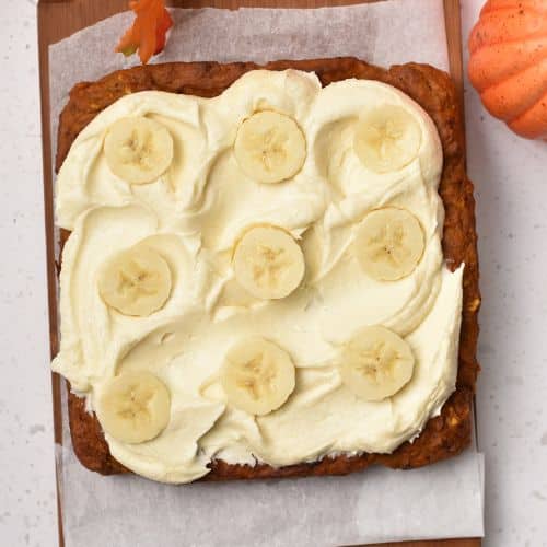 Frosting and banana slices on Pumpkin Banana Cake.