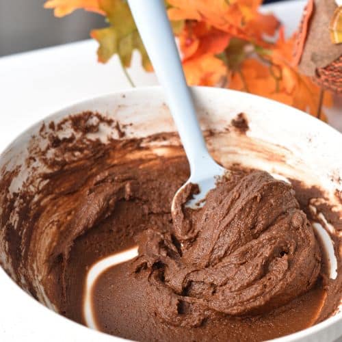 Pumpkin Brownie Bites dough stirred with a spatula.