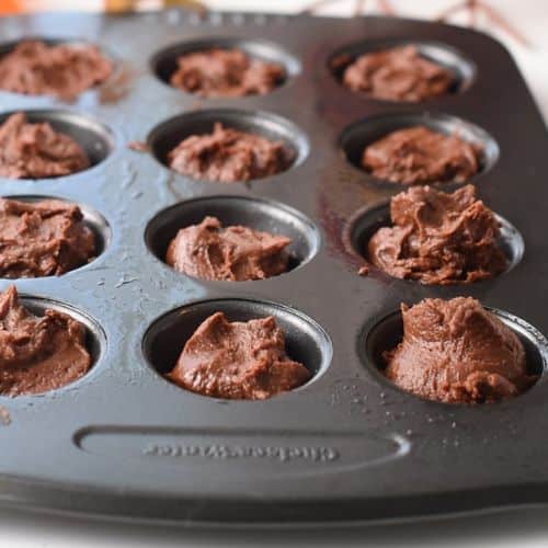 Pumpkin Brownie Bites ready to bake in the muffin tin.