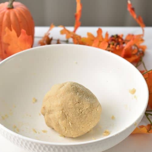 Pumpkin Pie Cookie dough ball in a bowl.