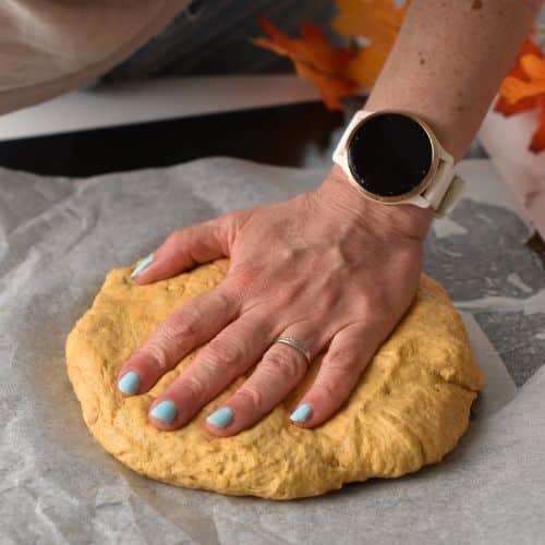 Flattening the Pumpkin Scones dough disc.