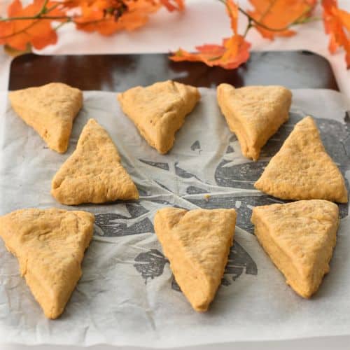 Pumpkin Scones ready to bake on a baking sheet.