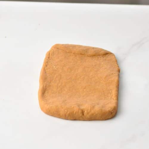 Pumpkin Stick Cookies dough flattened into a rectangle.