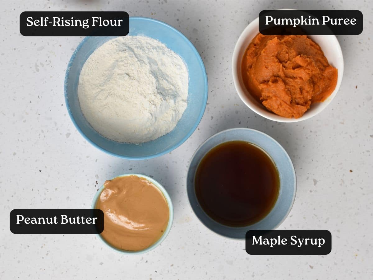 Ingredients for Peanut Butter Pumpkin Bread in small bowls.