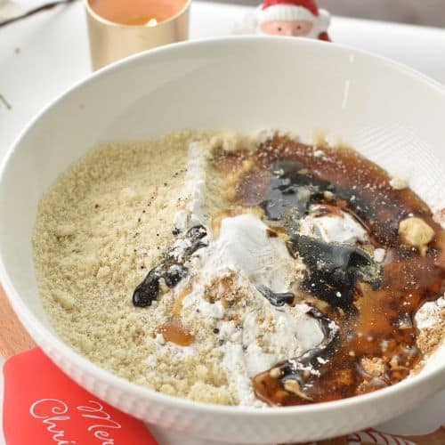 Almond Flour Gingerbread Cookies ingredients in a mixing bowl.