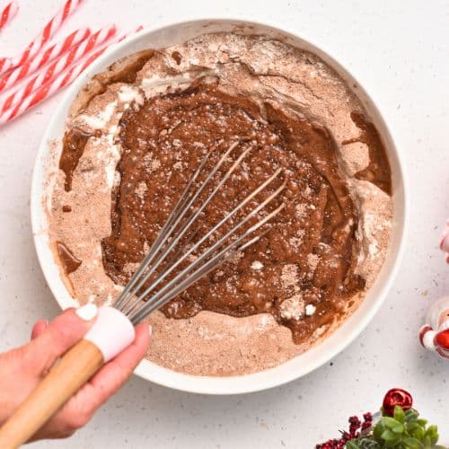 Adding chocolate to the Chocolate Peppermint Cake.