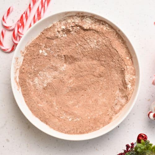 Dry Chocolate Peppermint Cake ingredients in a mixing bowl.