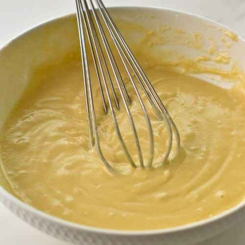 Easy Vanilla Cupcake dough mixed in a bowl with a whisk.