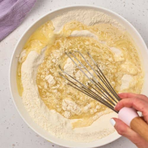 Stirring the Easy Vanilla Muffin batter.