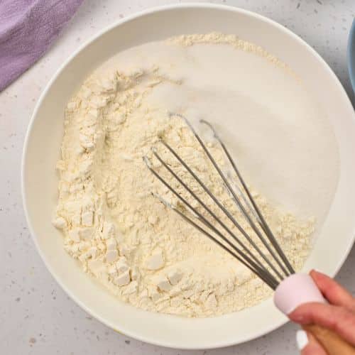 Whisking dry Easy Vanilla Muffin ingredients.