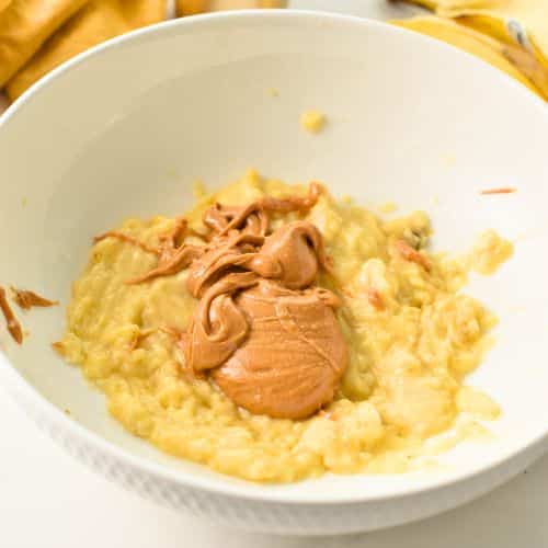 Banana puree and peanut butter in a bowl.