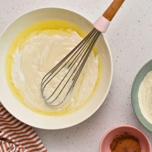 Marble Pound Cake batter ingredients in a mixing bowl.