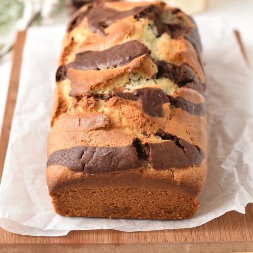 Marble Pound Cake cooling on a chopping board.